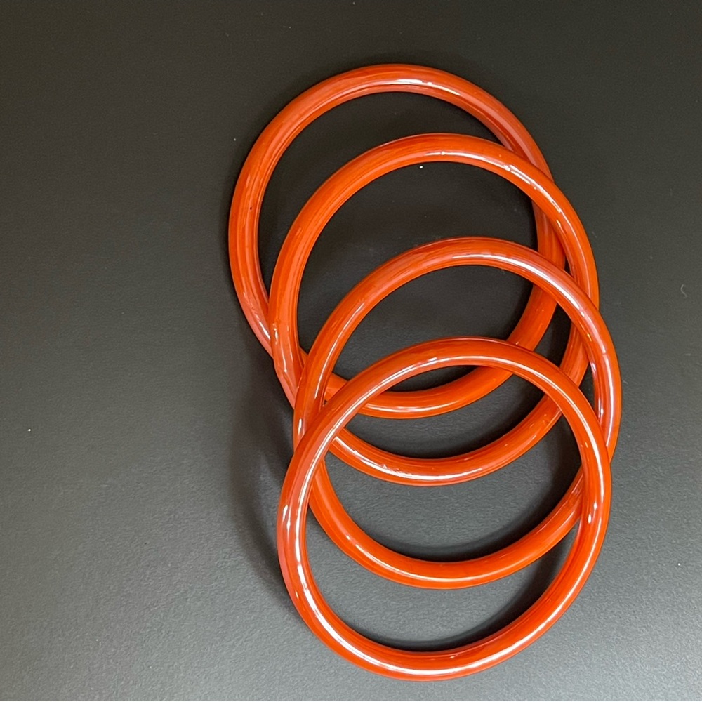 Coral colored glass bangles